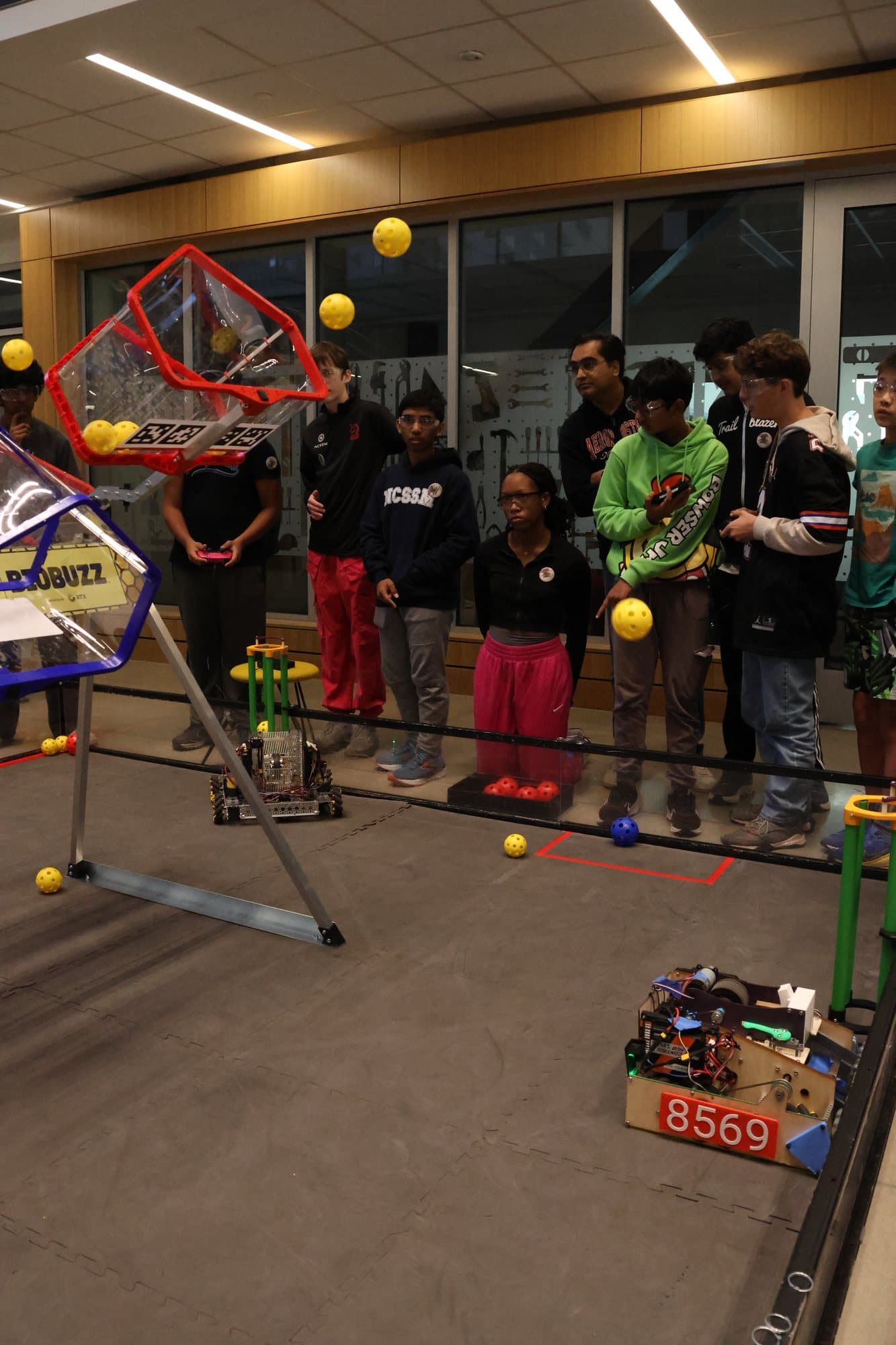 Drive teams lined up behind the field during a match