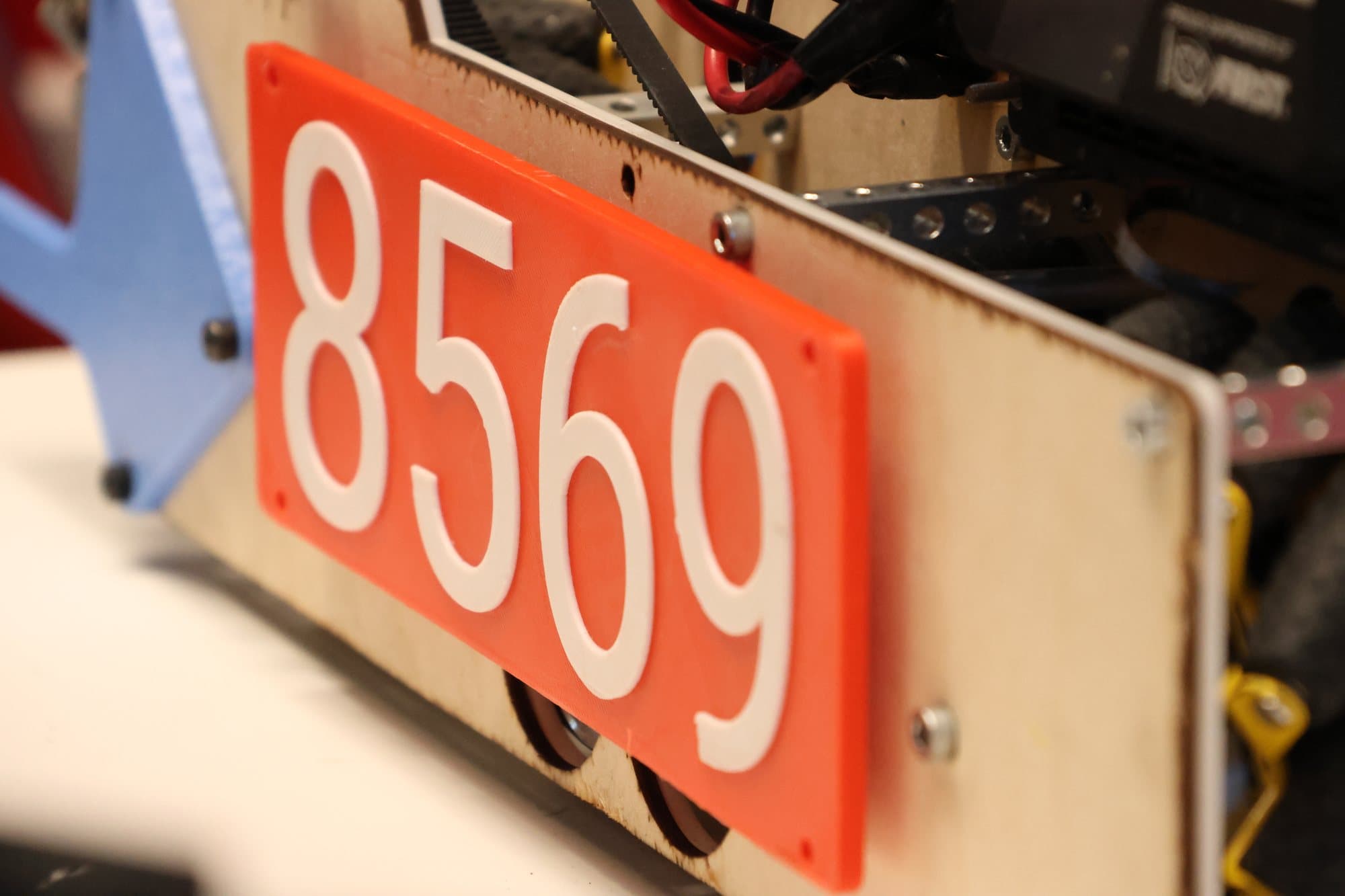 Close-up of the red 8569 number plate