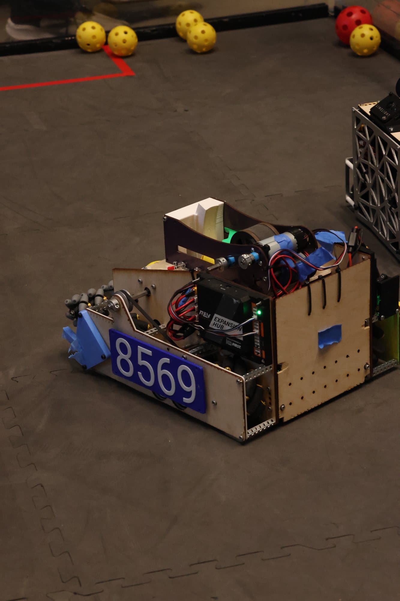 The 8569 robot with a blue number plate on the field