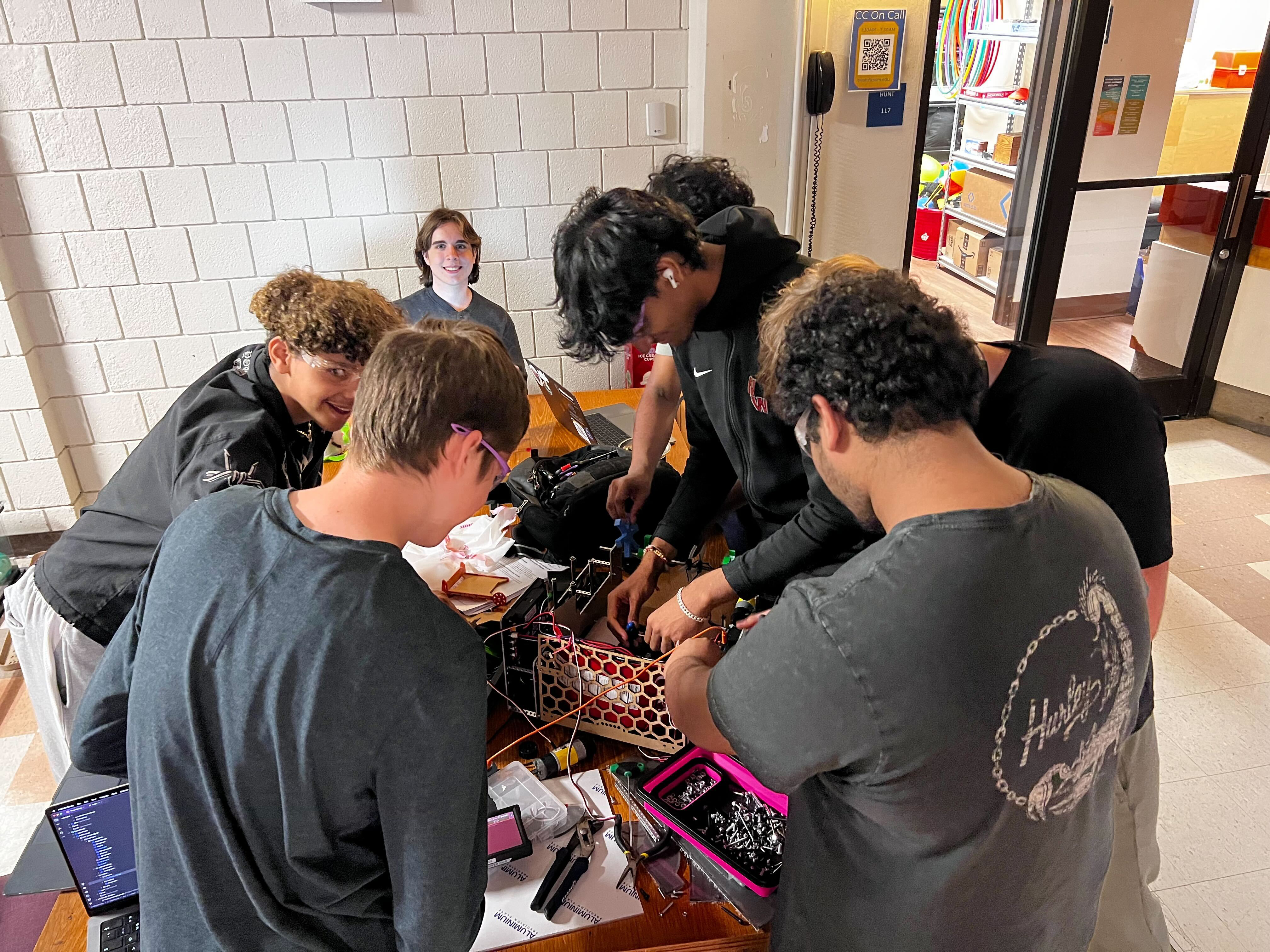 2 RoboKnights members working in parallel on the robot