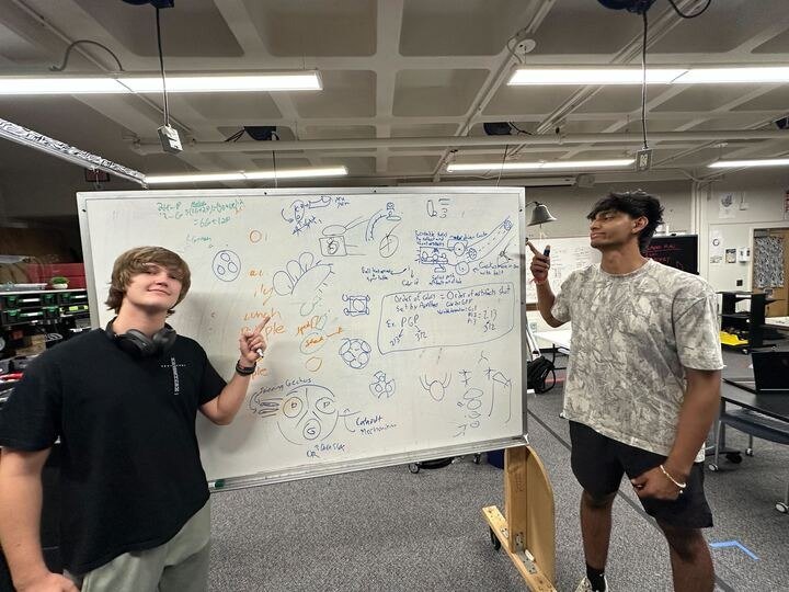 Working through a design on the whiteboard